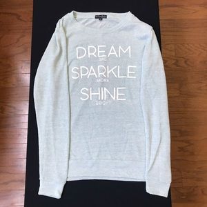 Light blue pullover sweater.